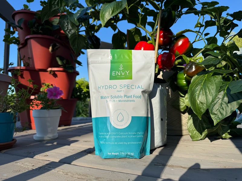 Image showing ENVY Hydro Special Hydroponic Fertilizer in front of pepper plants